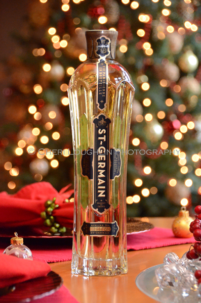 St-Germain Elderflower Liqueur is an artisanal French liqueur created only once per year in late spring.  It is said to be 100% all natural with no preservatives.  It is created from elderflower blossoms in limited quantities.  Officially St-Germain tastes like tropical fruit, citrus and orchard fruits.  The flavor is soft and lilting on the tongue making it perfect for light sipping or adding that finishing touch to delicate cocktails.- photo by Mixologist Cheri Loughlin, The Intoxicologist
