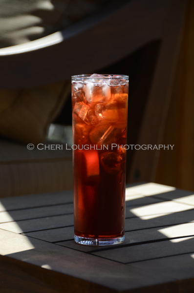 The Americano classic cocktail is a lovely summer sipper that easily plays out well as a holiday drink with its vibrant red color and deep, lush flavor. - photo by Cheri Loughlin, The Intoxicologist