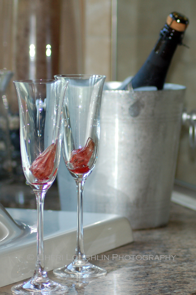 Hibiscus flowers in champagne flutes. Spanish Cava in champagne bucket. - photo by Cheri Loughlin, The Intoxicologist