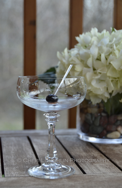 Luxardo Maraschino Cherry in empty glass. Pour in liquids & then swirl to incorporate syrup surrounding cherry. - photo by Cheri Loughlin, The Intoxicologist