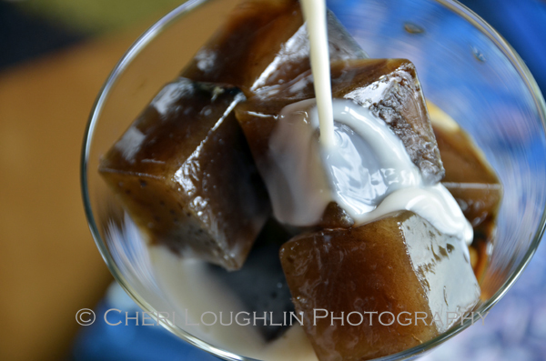 Pouring liqueurs over easy to make Coffee Ice Cubes – photo by Cheri Loughlin