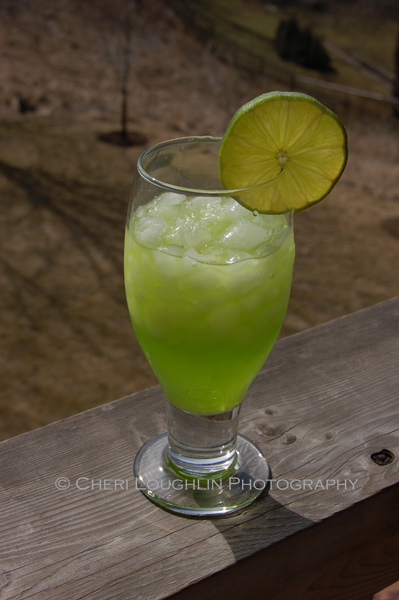 Lunar Leprechaun uses Melon Liqueur for a new color and new flavor take on the traditional Margarita. – photo and recipe by Mixologist Cheri Loughlin, The Intoxicologist
