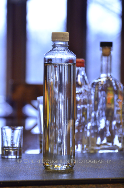 Clean and reuse emptied liquor bottles for your simple syrup recipe, sour mixes and other infusions. - photo by Cheri Loughlin, The Intoxicologist