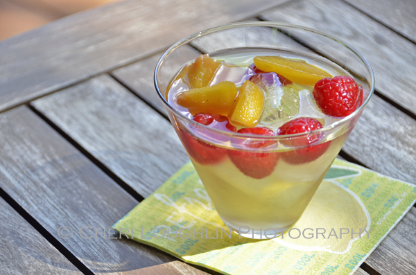 Sweet Raspberry Peach Sangria is excellent for summer entertaining. Double the recipe for a large pitcher to serve a crowd. - recipe and photo by Mixologist Cheri Loughlin, The Intoxicologist