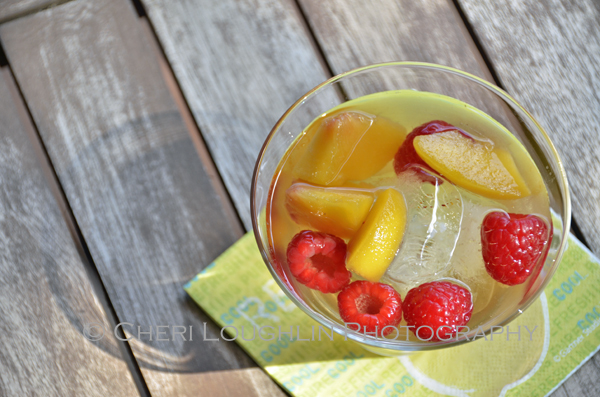 Use frozen unsweetened peaches if fresh peaches are unavailable. Top your Sweet Raspberry Peach Sangria with sparkling wine, lime flavored sparkling water or club soda if desired. - recipe and photo by Mixologist Cheri Loughlin, The Intoxicologist