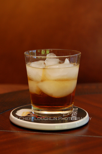 The Rusty Nail and Godfather Scotch Cocktails are two ingredient drinks. One uses Drambuie, the other uses Amaretto. Measurements vary depending upon bartender, website or cocktail book. Godfather drink pictured. - photo by Mixologist Cheri Loughlin, The Intoxicologist