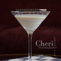 Candy Cane Martini created for Shellback Rum using peppermint schnapps, dark sumatra syrup and half & half with candy cane garnish {recipe and photo credit: Mixologist Cheri Loughlin, The Intoxicologist www.intoxicologist.net}