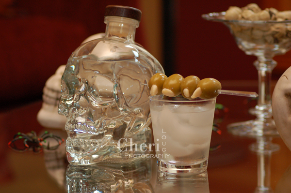 Bare Bones  recipe by Cheri Loughlin, The Intoxicologist 2 ounces Crystal Head Vodka Ice Garlic Stuffed Green Olives