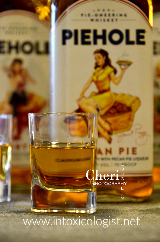 Piehole Whiskey recreates the flavors of popular pies in liquid form with the flavors of pecan pie, cherry pie and apple pie and some pretty awesome pin-up artwork on the label.